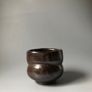 Curved black tea bowl