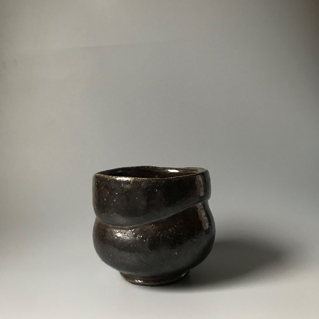 Curved black tea bowl